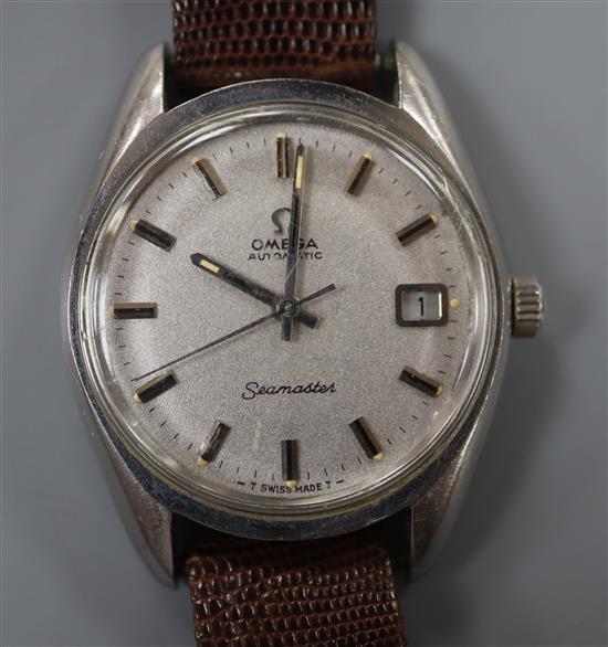 A gentlemans stainless steel Omega Seamaster automatic wrist watch, on associated lizard strap.